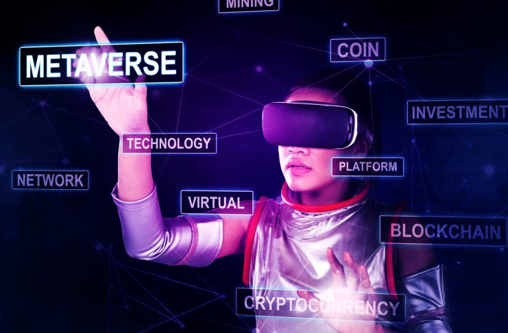 Futuristic woman touching metaverse word while trading cryptocurrency in the cyberspace
