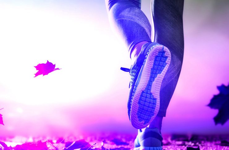 athlete's foots close-up on autumn walk in nature outdoors. healthy lifestyle and sport concepts.